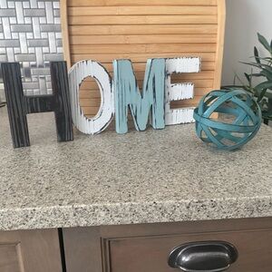 Source Unknown HOME Sign with Black, White, and Teal